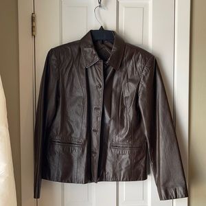 Brown leather jacket. Great condition! Approx 23”length and 19” shoulder width.